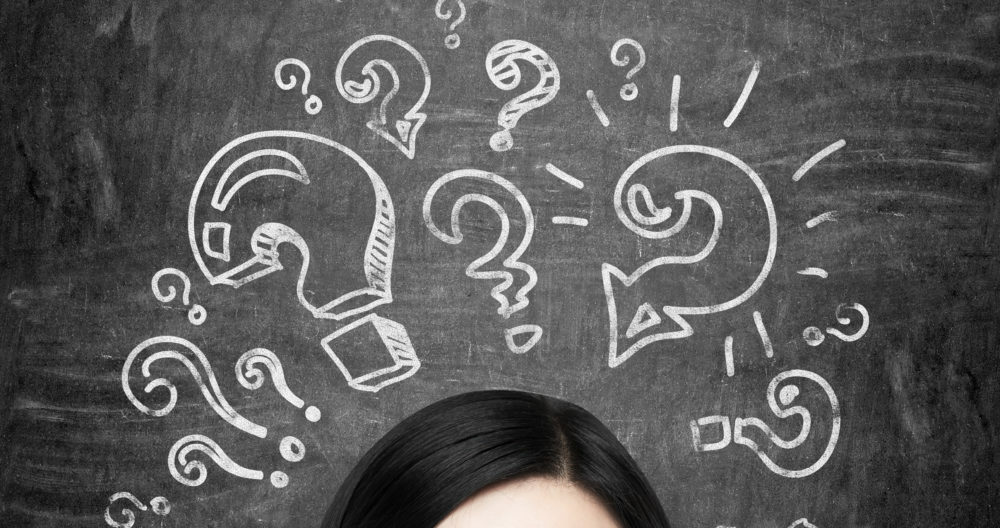 brunette girl who is pondering about unsolved problems