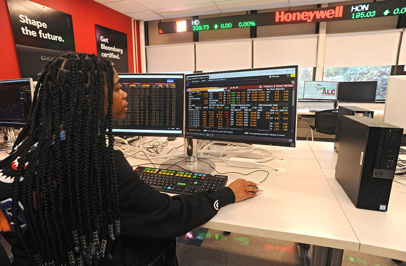 UCNJ student utilizing the Bloomberg terminal.