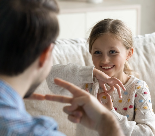 Adult and child using sign language