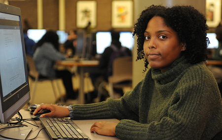 girl in front of computer, facing the camera.