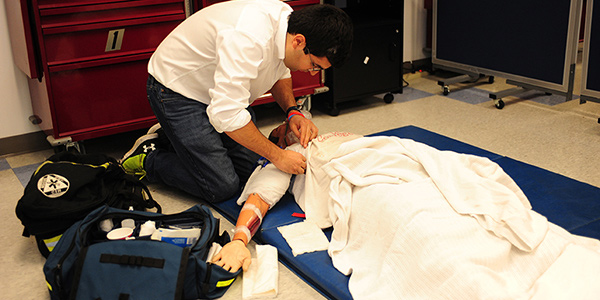 emt working over patient on the floor