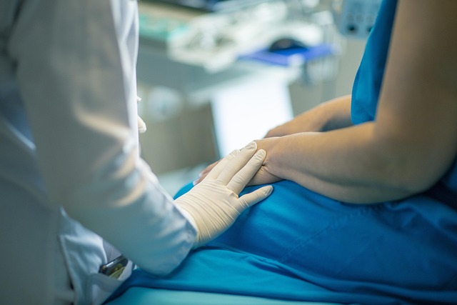 healthcare professional with hand on patient's knee